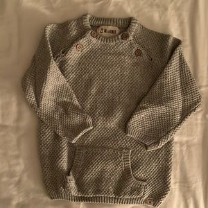 Gray knit sweater with buttons.